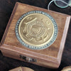 Top of Coast Guard medallion military compass box showing engraving in circle around medallion