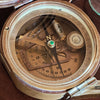 Closeup of inside of brass military compass